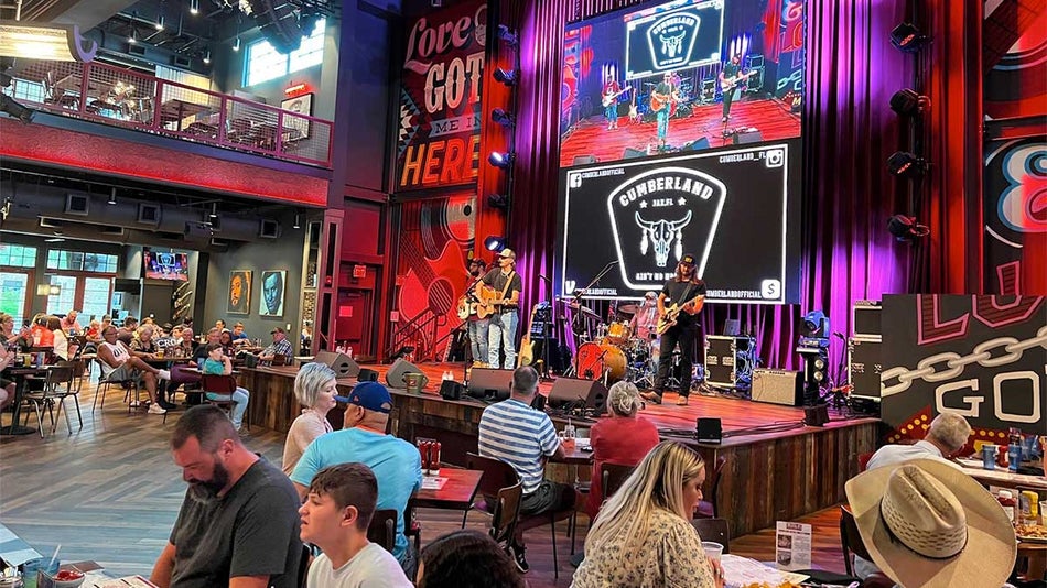 band performing on stage infront of diners at Ole Red Orlando in Orlando, Florida, USA