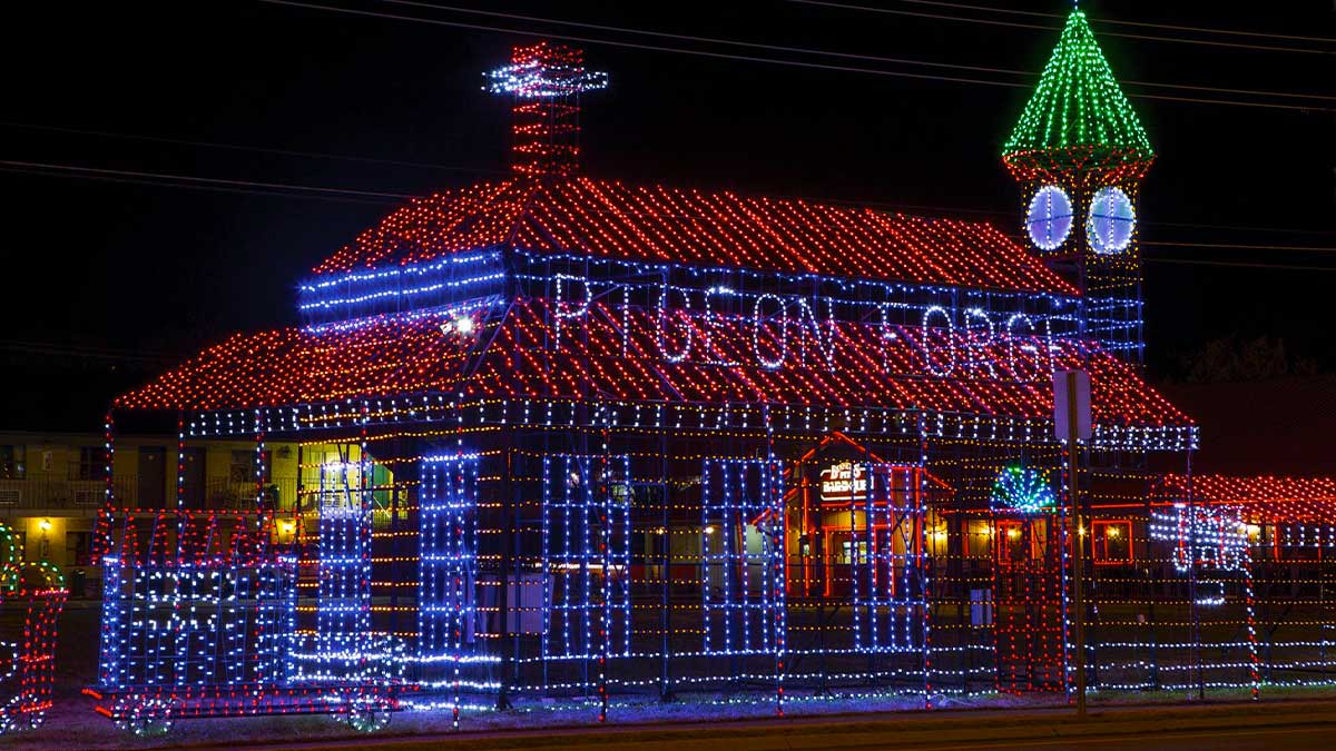 building covered in colorful lights at night for Pigeon Forge Winterfest in Pigeon Forge, Tennessee, USA