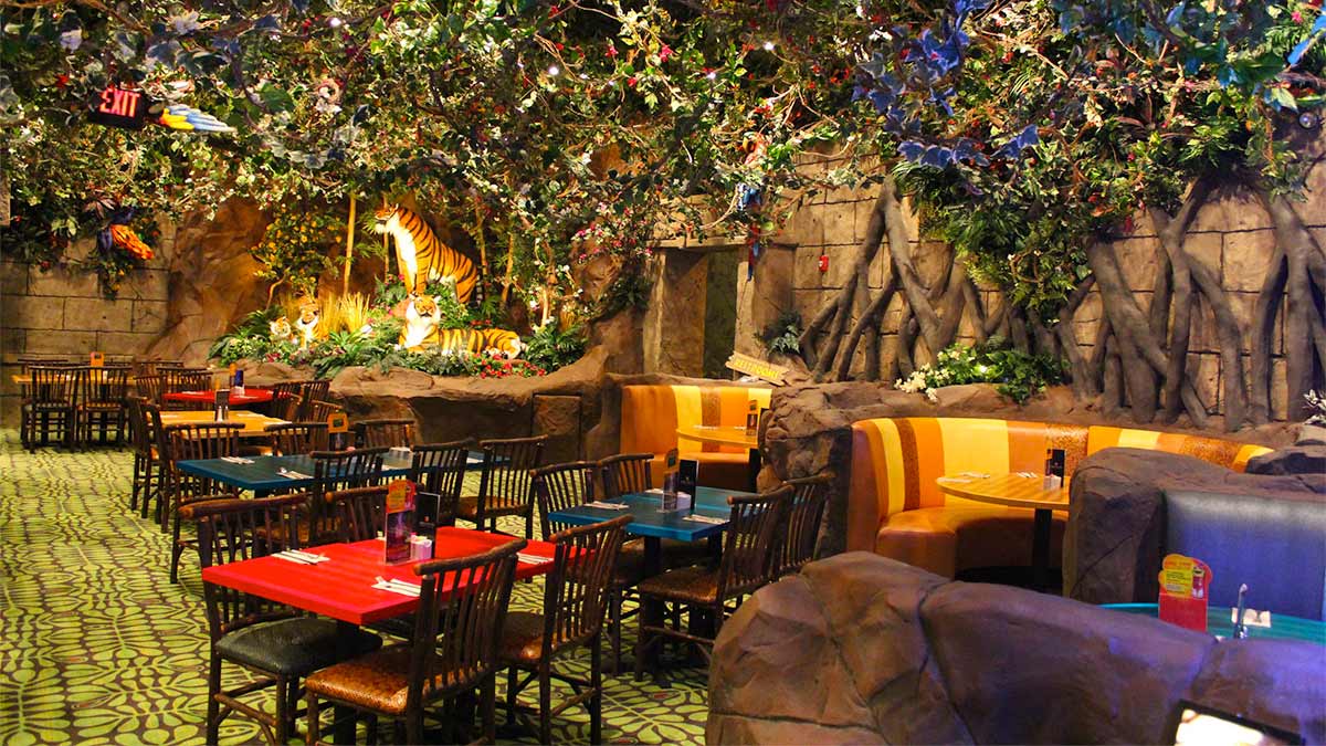 a picture of a restaurant with a forest theme.