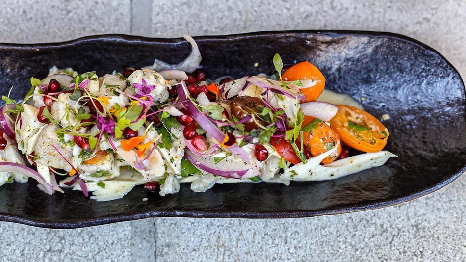close up of ceviche on black ceramic plate at Reyes Mezcaleria in Orlando, Florida, USA