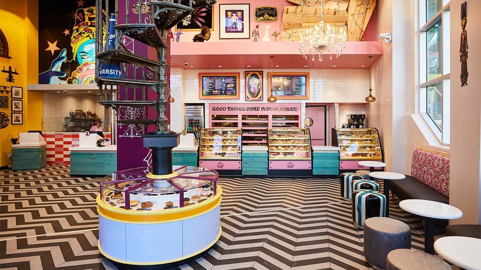 interior of Voodoo Doughnut with colorful furnishings and pastry displays in Orlando, Florida, USA