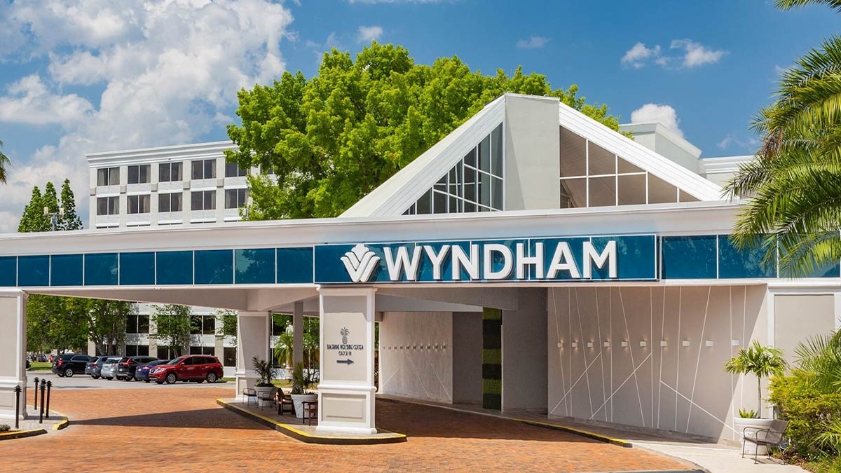 entrance to Wyndham Orlando Resort and Conference Center Celebration Area with parked cars in Orlando, Florida, USA
