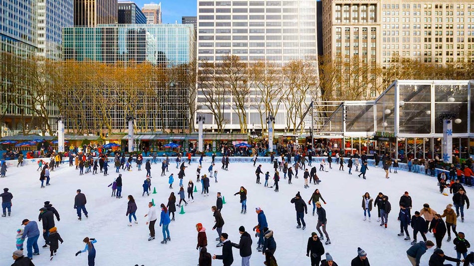 a distant view of a people in the ice roller skating