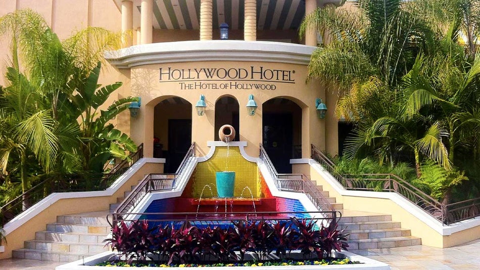 The front view of the Hollywood Hotel with a mini fountain