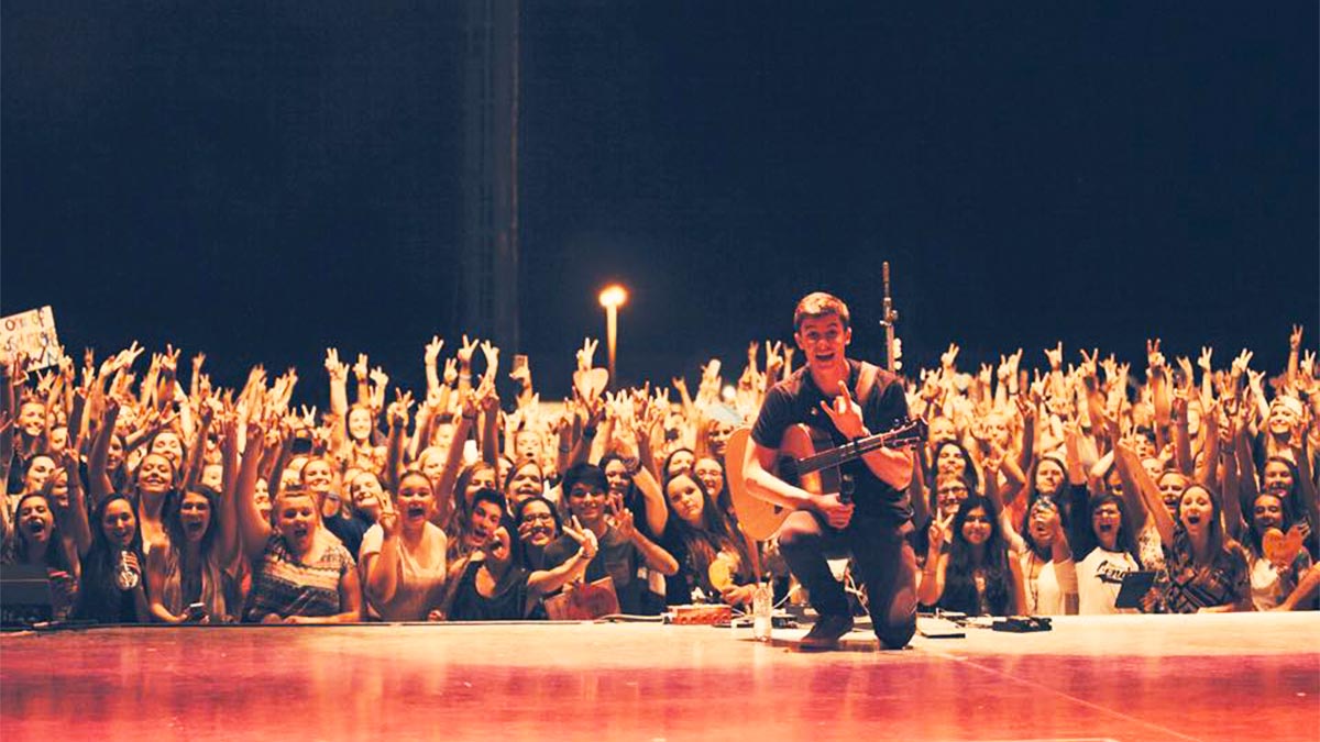 performer with guitar on stage posing with crowd at Wild Adventures Concerts in Valdosta, Georgia, USA