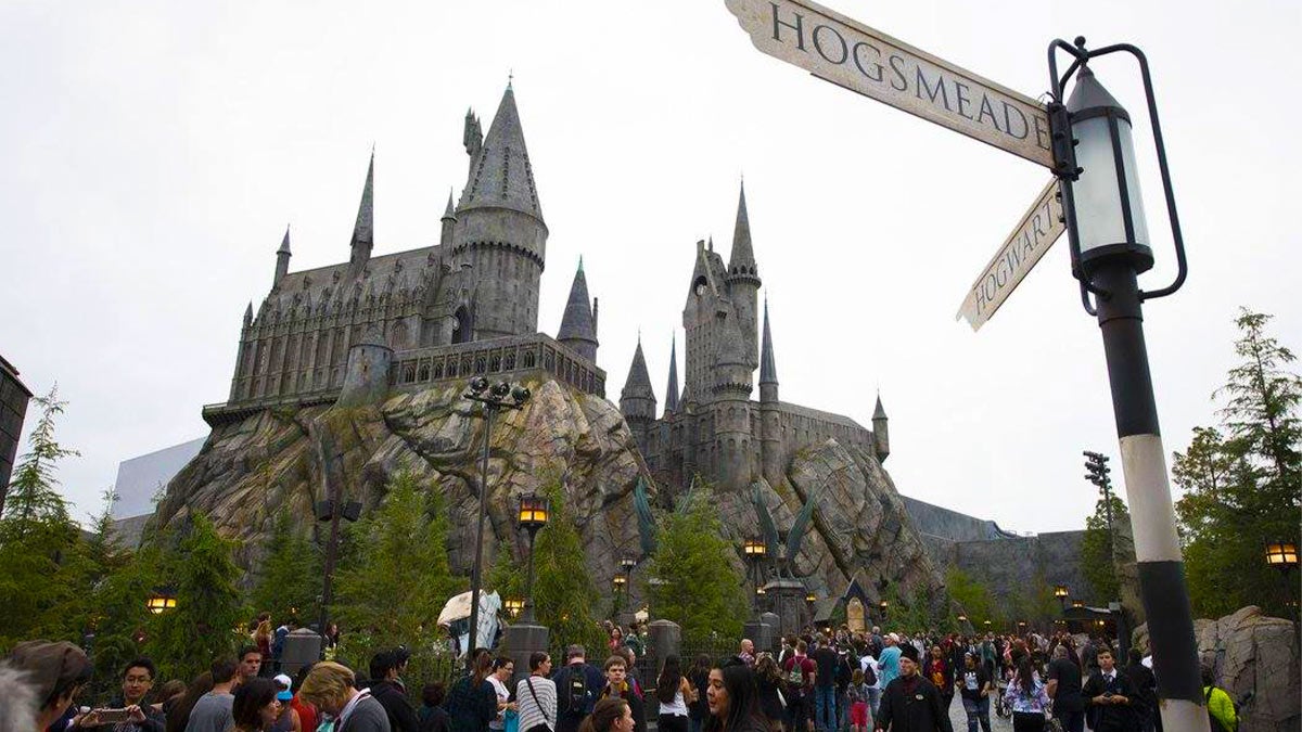 Tourists having fun at Universal Studios' Hogwarts.