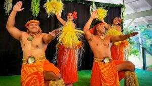 close up of dancers in traditional costume on stage at Toa Luau in Oahu, Hawaii, USA