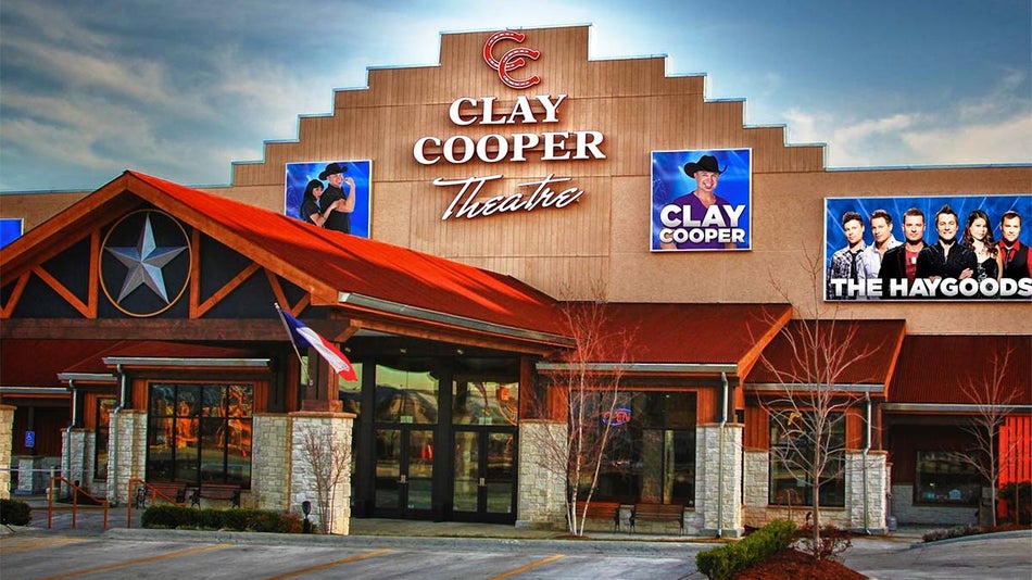 exterior of Clay Cooper Theatre with posters on building during daytime in Branson, Missouri, USA