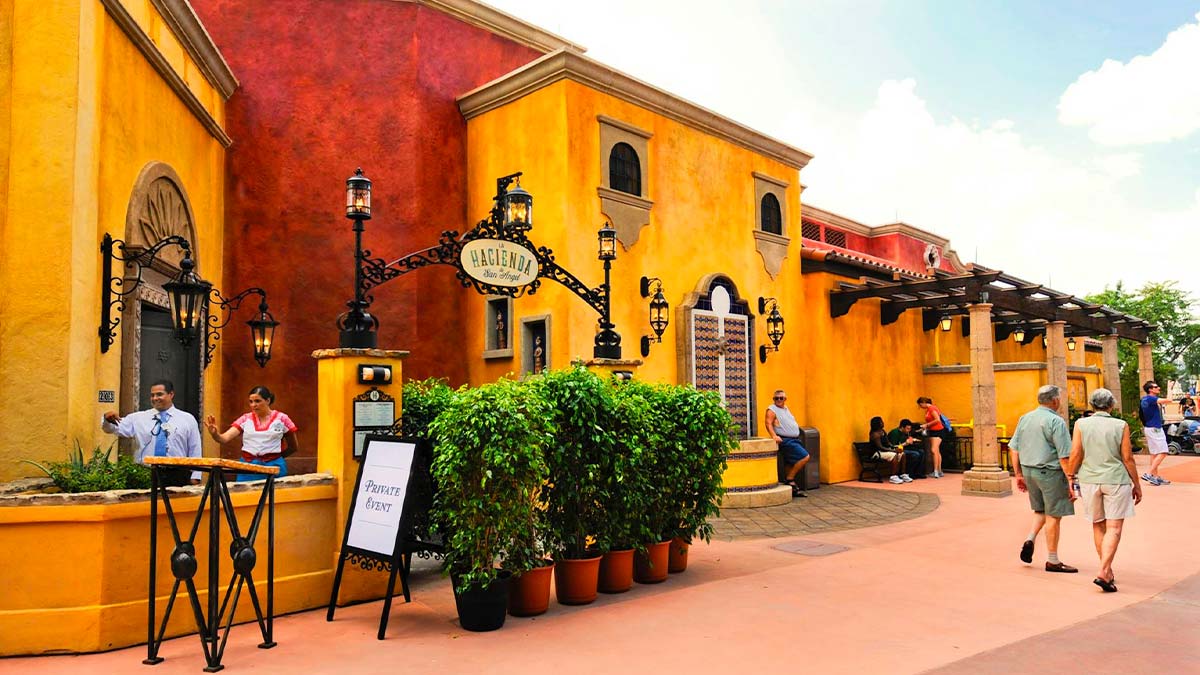 exterior of La Hacienda de San Angel Mexico on a sunny day with people walking at Epcot in Orlando, Florida, USA