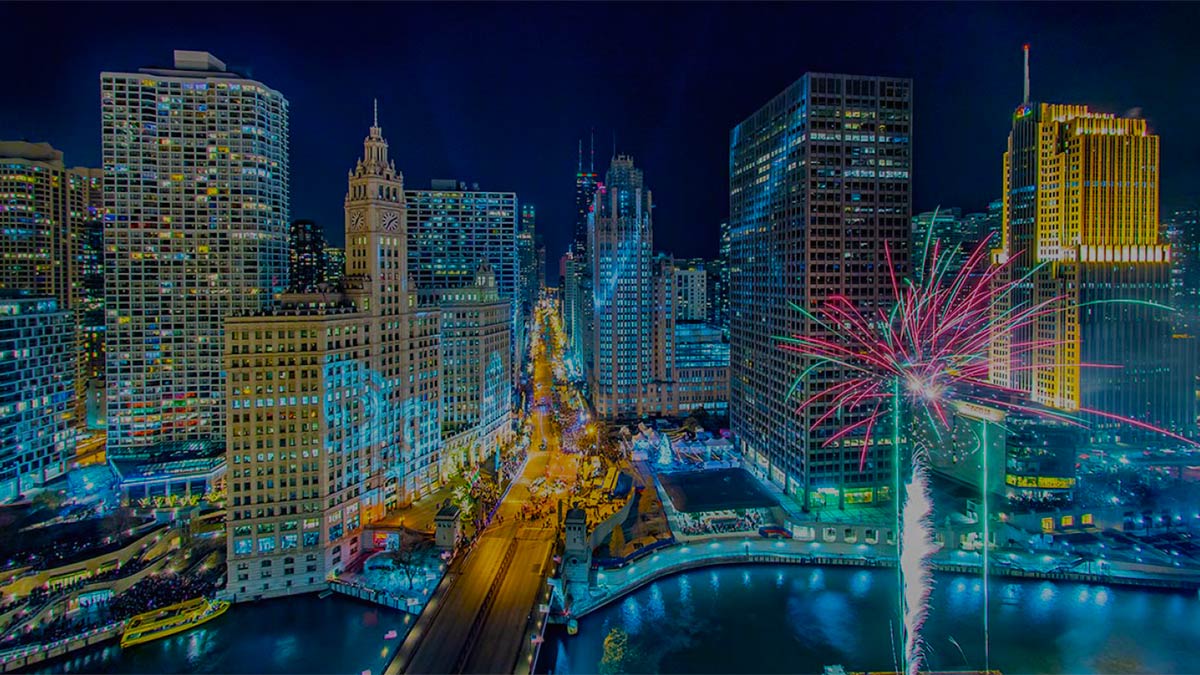 aerial of Chicago skyline with fireworks at night at Magnificent Mile Lights Festival in Chicago, Illinois, USA