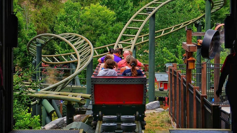 View of the back of kids at the start of a rollercoaster ride at Dollywood