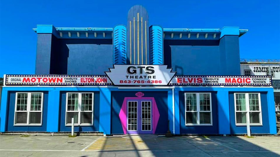 Exterior of GTS Theatre with large sign above entrance during sunny day in Myrtle Beach, South Carolina, USA
