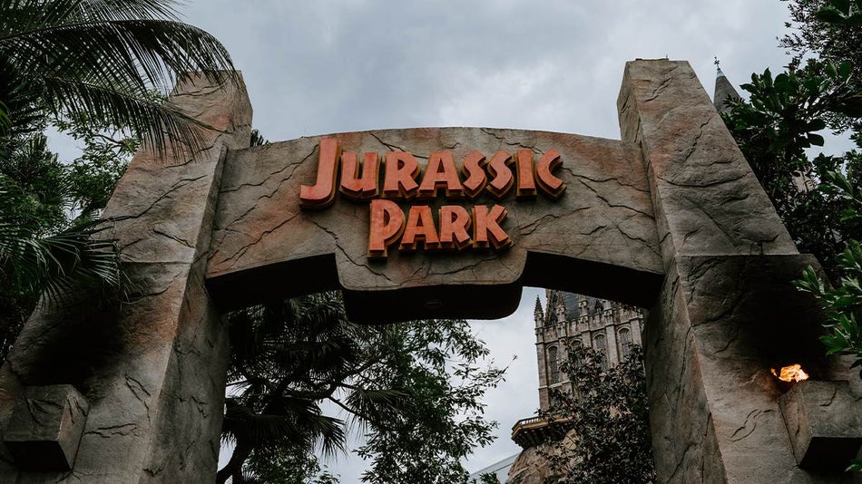 Close up photo of the entrance to Jurassic Park in Universal Studios in Orlando, Florida, USA