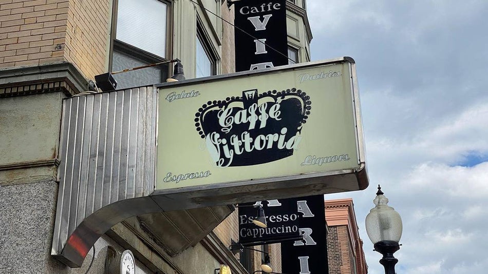 View of the Caffe Vittoria sign from the street below in Boston Massachusetts