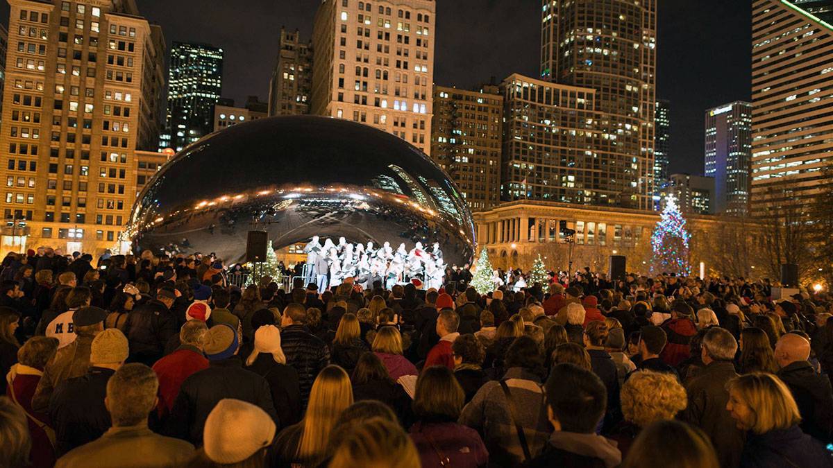 Crowd gathered for Caroling at Cloud Gate in Chicago, IL, USA