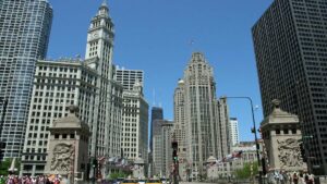 The Magnificent Mile Buildings from ground with taxis and pedestrians in Chicago, Illinois, USA