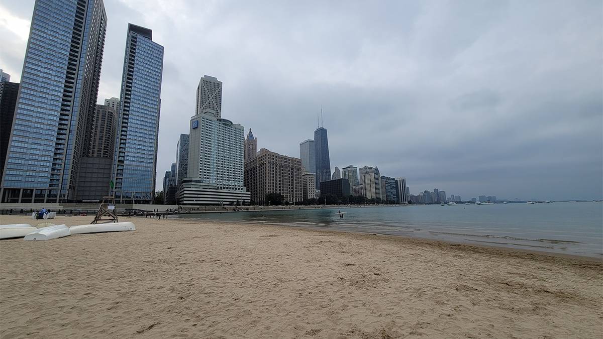 Wide shot of Ohio Street Beach with the city in the background on a cloudy day in Chicago, Illinois, USA