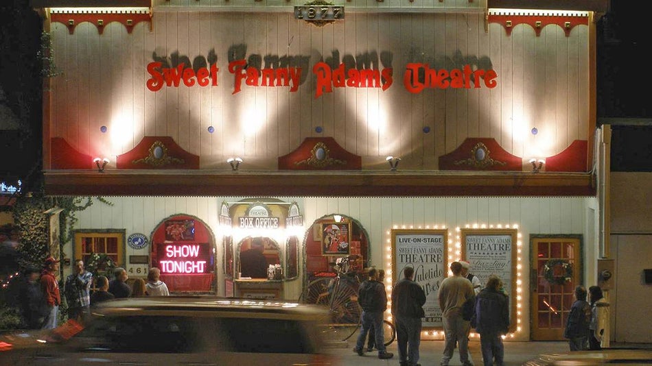Exterior night view of Sweet Fanny Adams Theatre with lights in Gatlinburg, Tennessee, USA