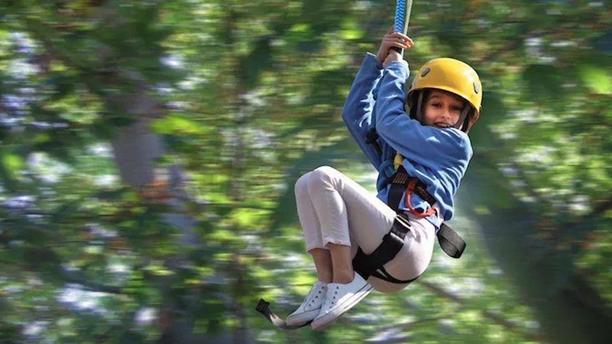 little girl with yellow helmet at Zipping in the Smokies with Rafting in the Smokies in Gatlinburg, Tennessee, USA