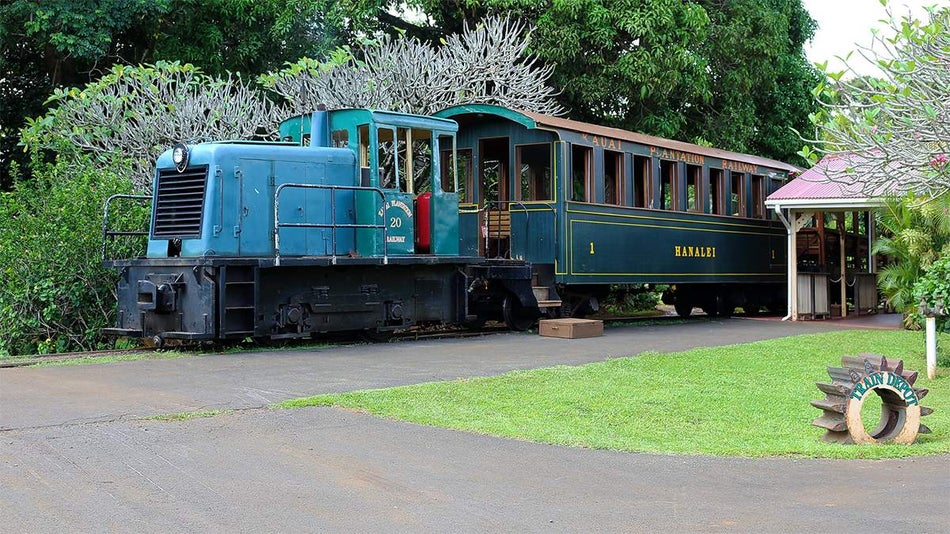 Exterior ground view of the green railroad and train depot at Kauai Plantation Railway in Kauai, Hawaii, USA