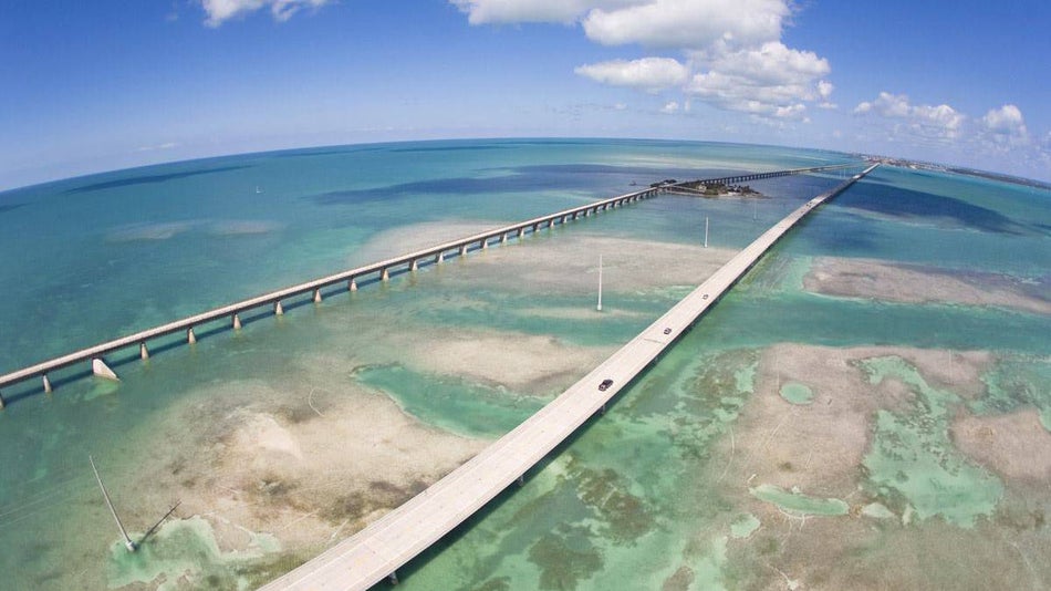 Aerial view of the United States Overseas Highway on a bright sunny day with clear water near Key West, Florida, USA