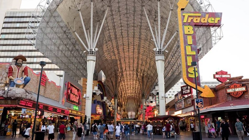 Ground distant view of shops and people at Fremont Street during the day in Las Vegas, Nevada, USA