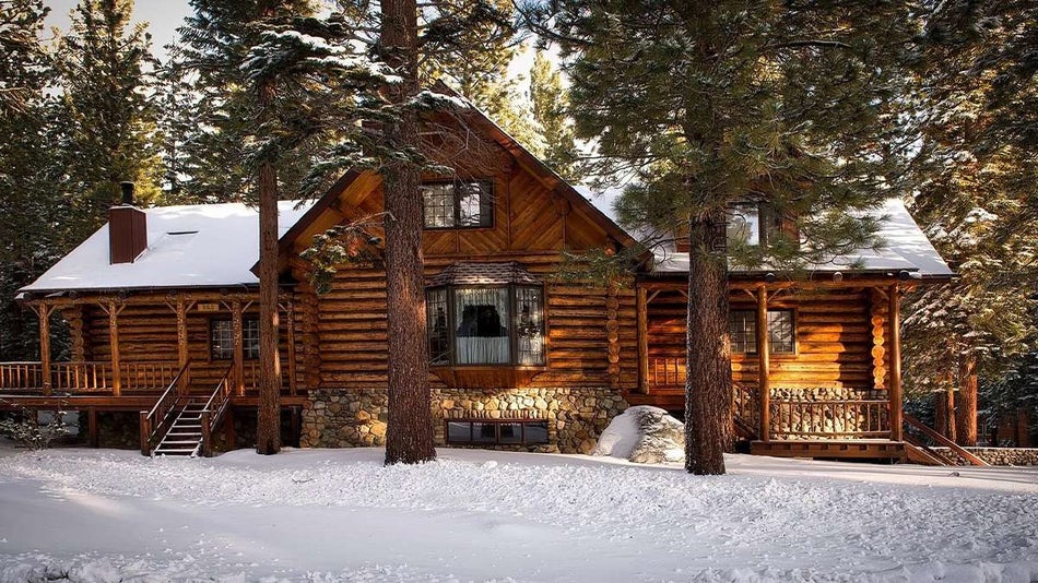 log cabin in winter woods
