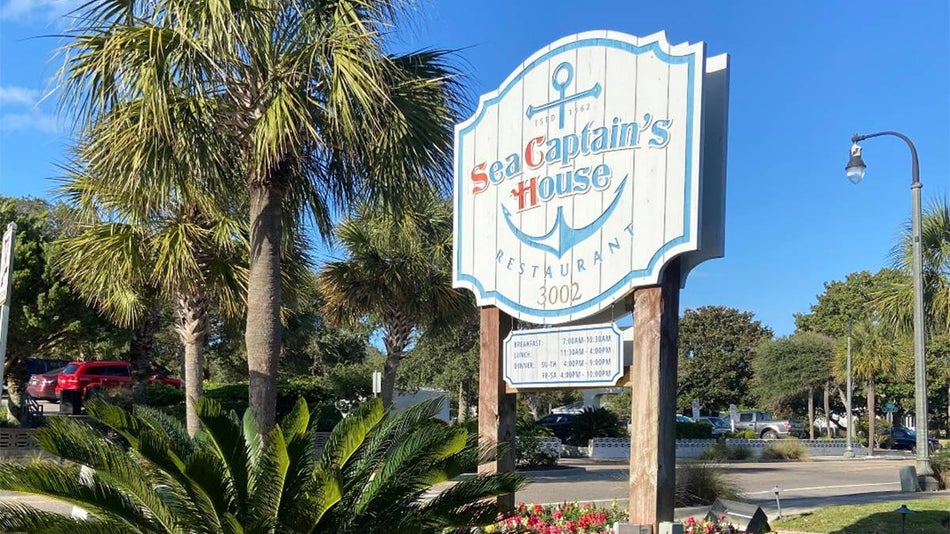 Close up of sign for Sea Captain’s House in Myrtle Beach, South Carolina, USA