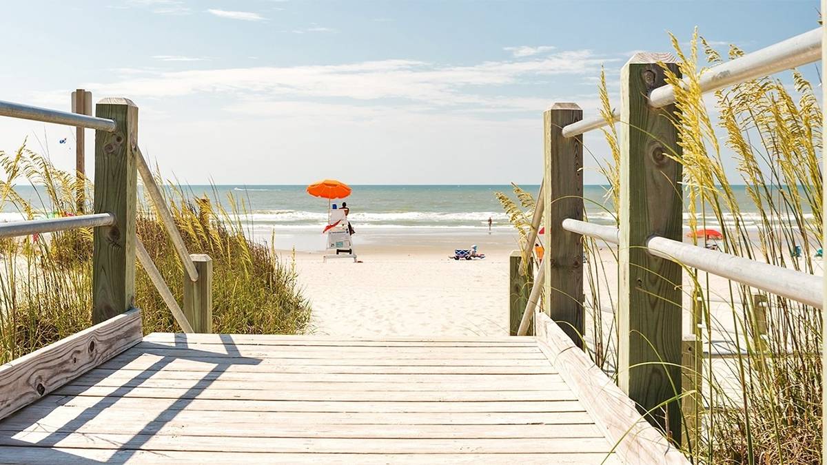 Lifeguard stand and a Wooden Pathway to the Beach in Myrtle Beach, South Carolina, USA