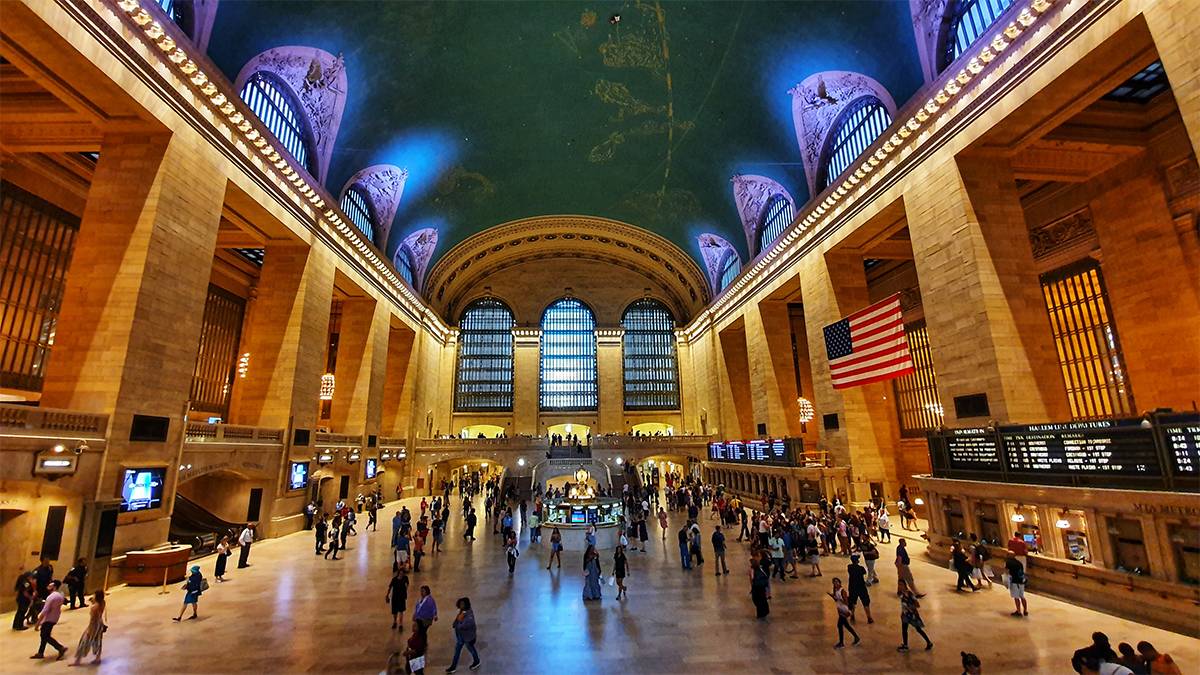 interior view of crowds of people inside grand central station in nyc