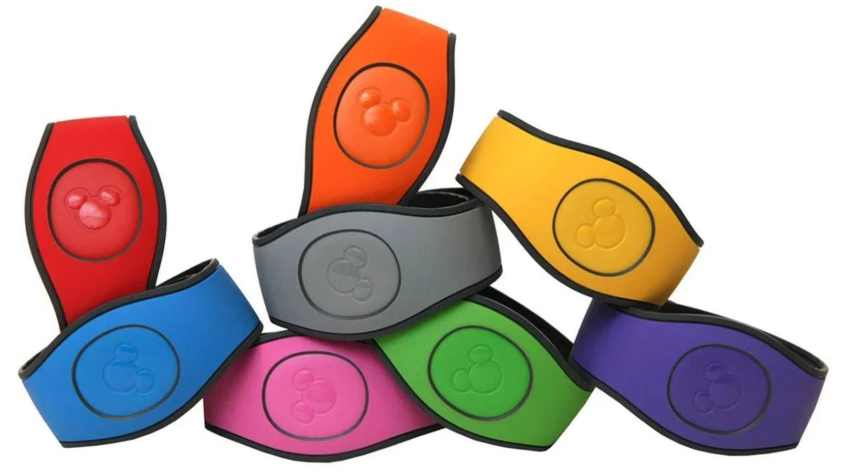 Close up of a cluster of magic bands, all the colors of the rainbow, on a white back ground for Walt Disney World in Orlando, Florida, USA