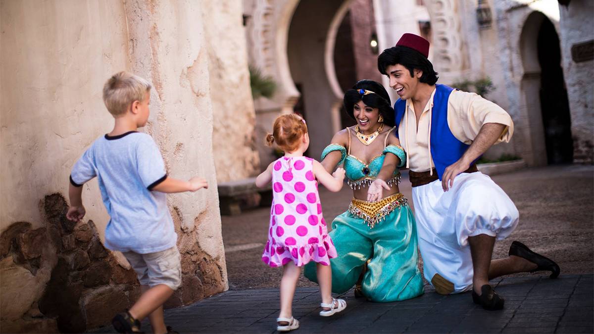 Close up of two children running to Aladin and Jasmine at a Meet and Greet at Walt Disney World in Orlando, Florida, USA