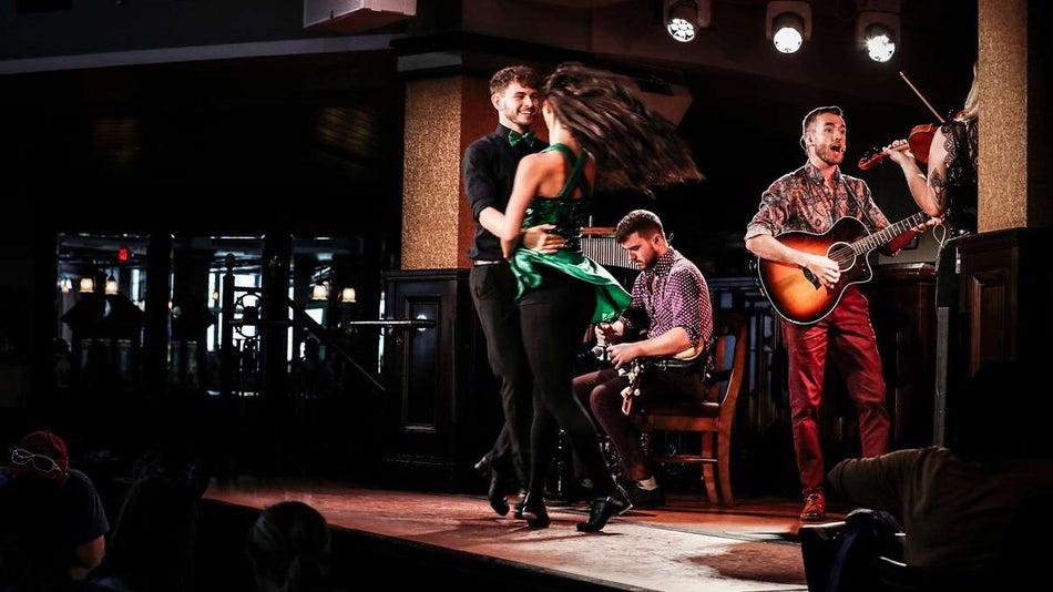 View of performers dancing and playing music on the stage at Raglan Road Irish Pub and Restaurant in Orlando, Florida, USA