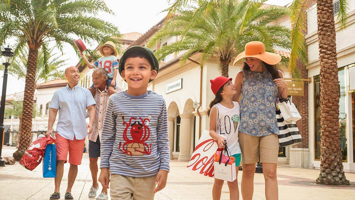 Close up of a family shopping at Disney Springs on a sunny day in Orlando, Florida, USA