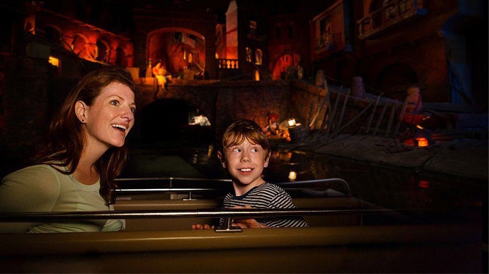 Mother and Son riding Pirates of the Caribbean at Walt Disney World's Magic Kingdom - Orlando, Florida, USA