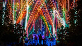 fireworks behind disney castle at disneyland