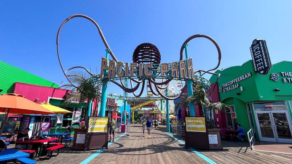 pacific park sign surrounded by buildings on the santa monica pier