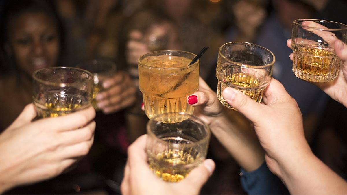 People toasting and drinking in a bar at Seattle