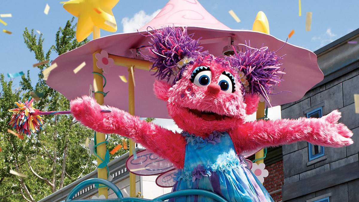 Close up of Abby dancing with a wand in her and confetti falling around her at Abby’s Sea Star Spin at SeaWorld in San Diego, California, USA