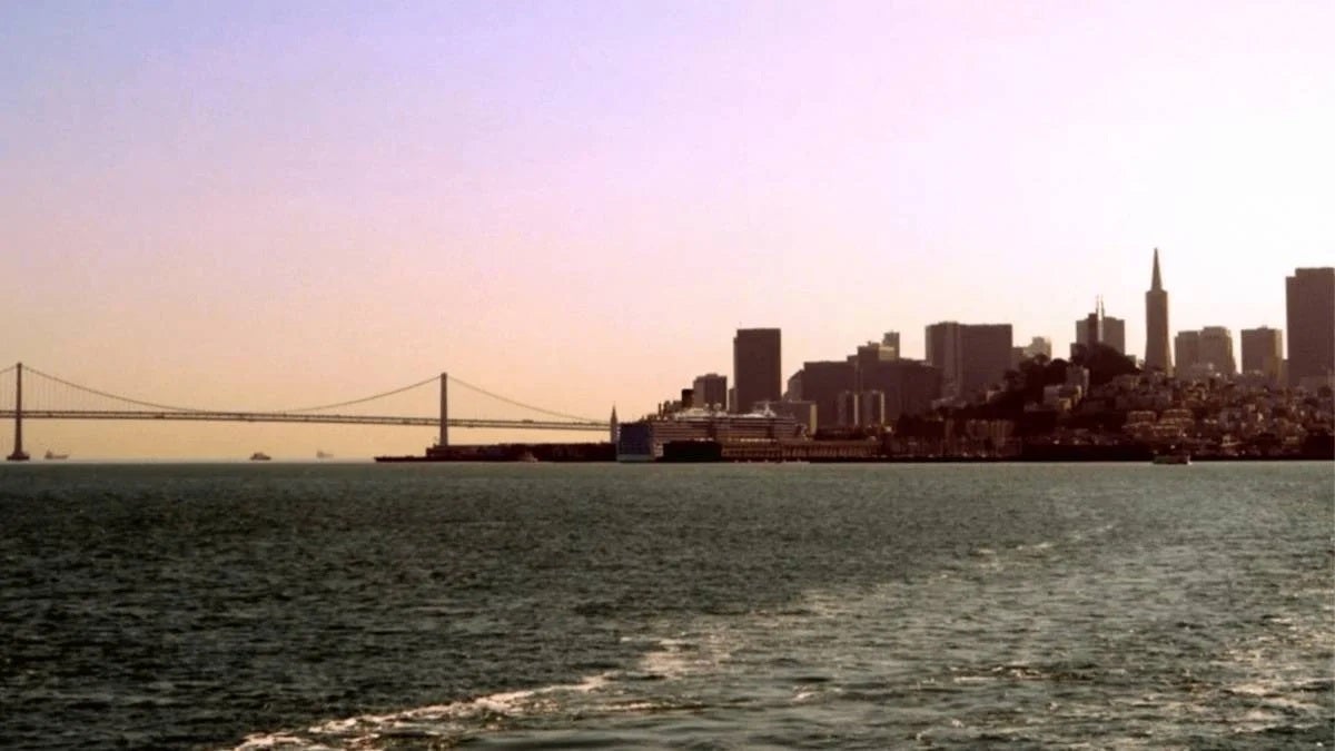 View of downtown skyline at sunset from the Ferry headed to Alcatraz Island in San Francisco, California, USA