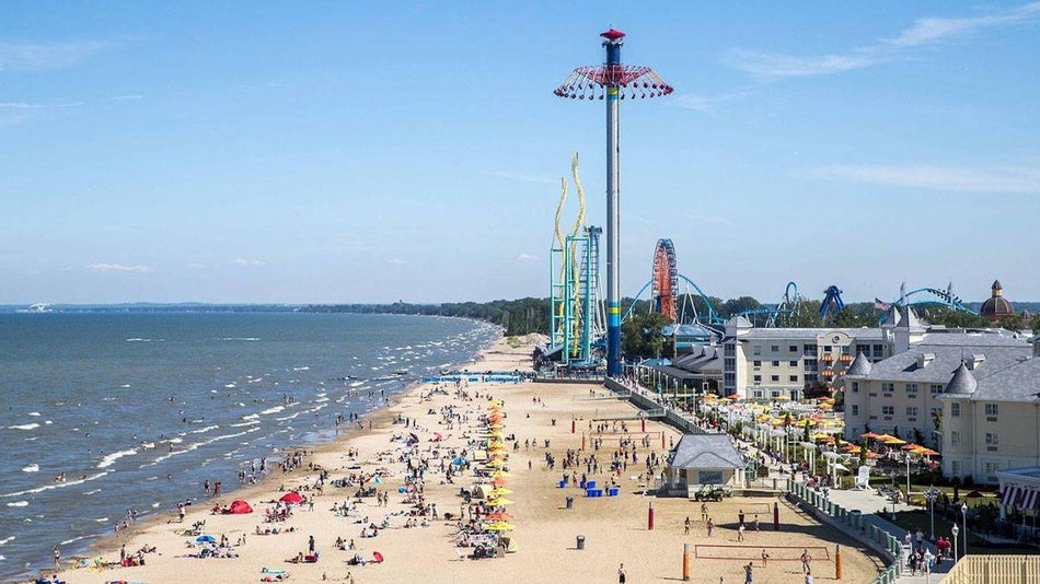 Aerial view of the crowd of people in the coastline at Cedar Point Beach