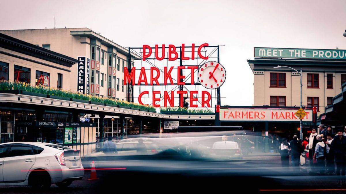 Close up sign and cars at Public Market Center in Seattle, Washington, USA