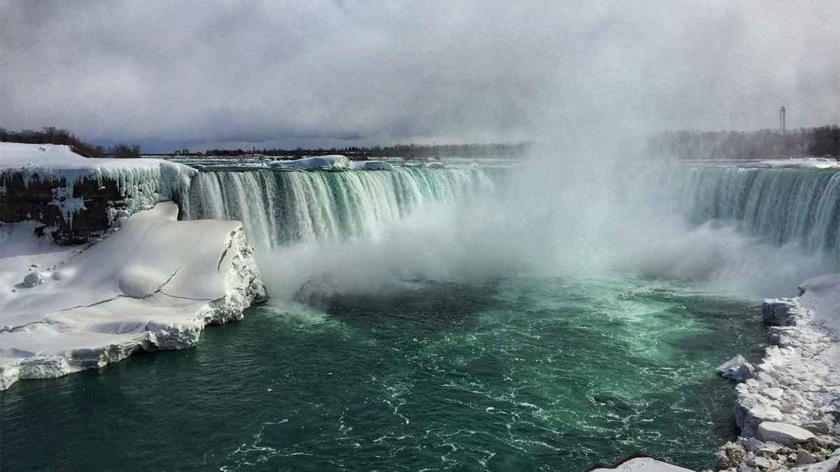 View of niagara falls with snow and ice surrounding