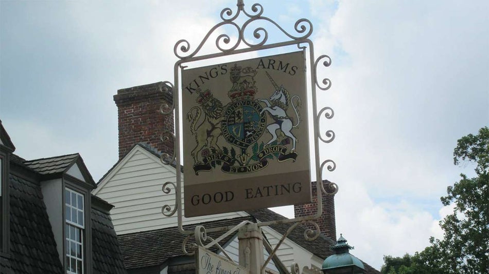 Close up of a small sign with a crest on it for King’s Arms Tavern Washington Wine Dinner in Williamsburg, Virginia, USA