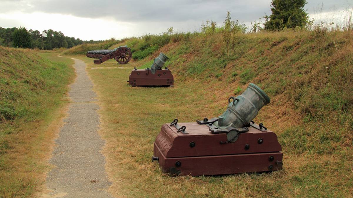 Close up of the cannons on the surrender fields at Yorktown Battlefield on a cloudy day in Williamsburg, Virginia, USA