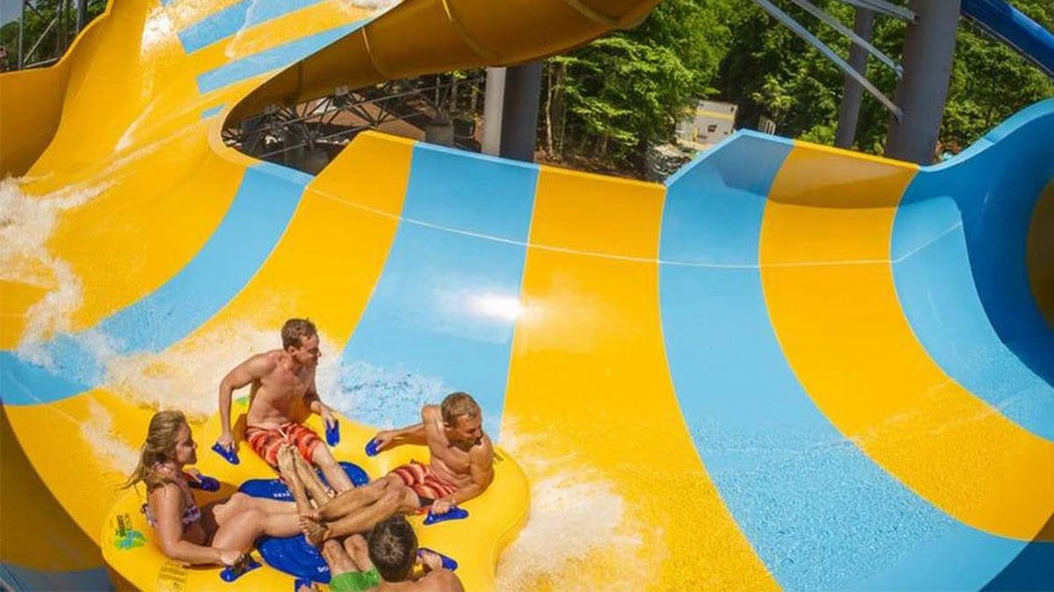 aerial view of family on raft sliding down the Colossal Curl at Water Country USA in Williamsburg, Virginia, USA