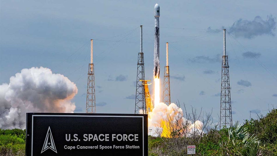 Wide shot of a Rocket Launching from Cape Canaveral with a sign for the US Space Force on a sunny day near Orlando, Florida, USA