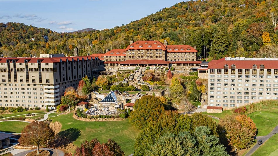Wide shot looking over Omni Grove Park Inn on a sunny day in the fall in Asheville, North Carolina, USA
