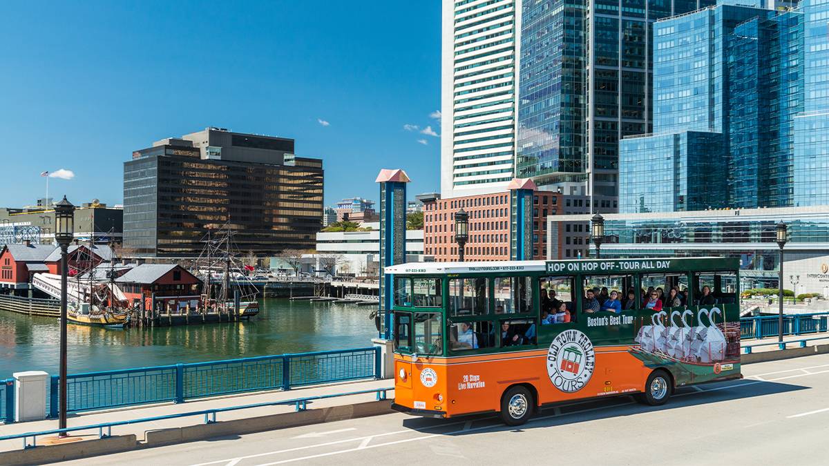 ground outdoor view or old town trolley tour in front of downtown buildings in Boston, Massachusetts, USA