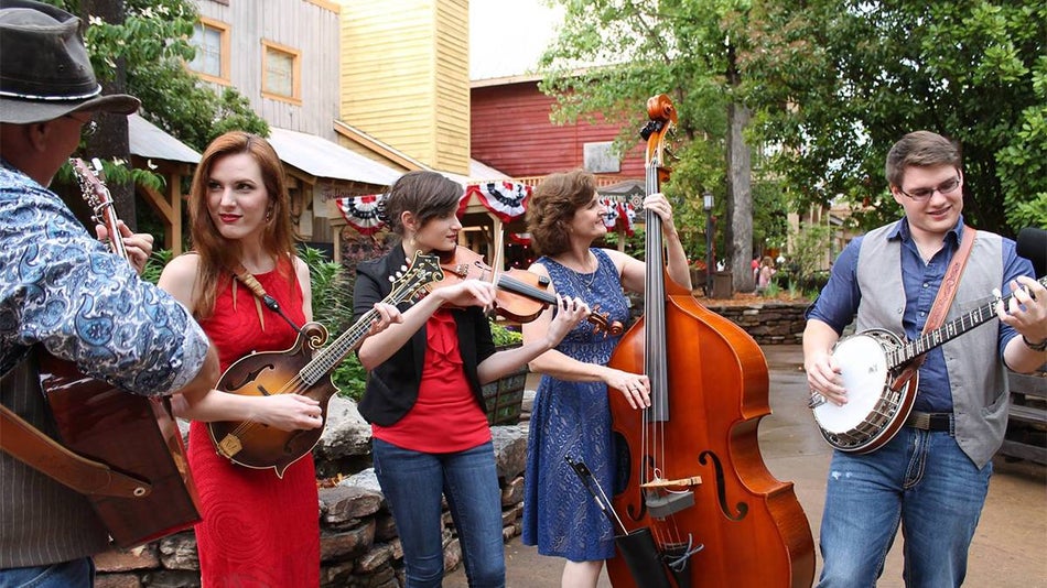 Bluegrass band standing playing their instruments at the Bluegrass and BBQ Festival in Silver Dollar City in Branson, Missouri, USA